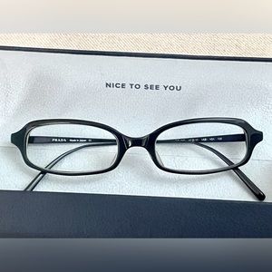 PRADA reading glasses.